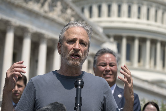 Jon Stewart with House Veterans Affairs Committee Chair Mark Takano, D-Calif., right, at the Capitol in Washington in May 2021.