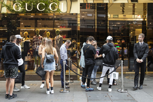 Shoppers Queue Outside Chanel Store On Editorial Stock Photo