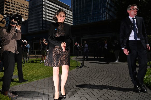 Premier Gladys Berejiklian is flanked by Treasurer Dominic Perrottet on Tuesday.