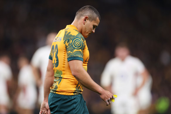 Wallabies back Izaia Perese leaves the field after being shown a yellow card for a controversial deliberate knockdown.