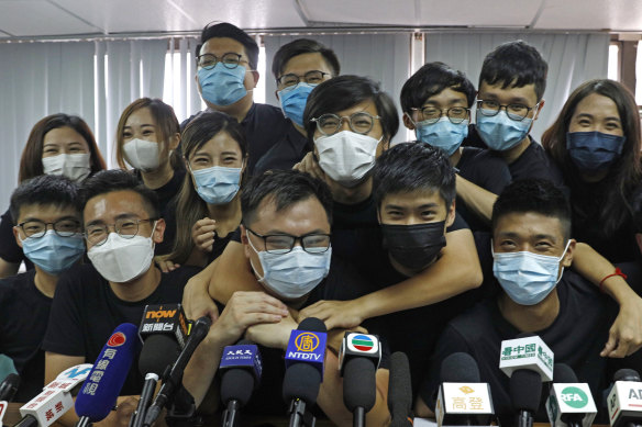 Activists who won in unofficial pro-democracy primaries, including Joshua Wong (left), attend a press conference last July.
