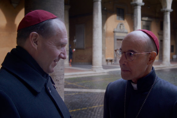Ralph Fiennes (left) as Cardinal Lawrence and Stanley Tucci as Cardinal Bellini in the film Conclave.