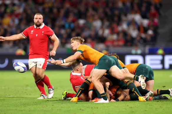 Tate McDermott passes from a ruck.