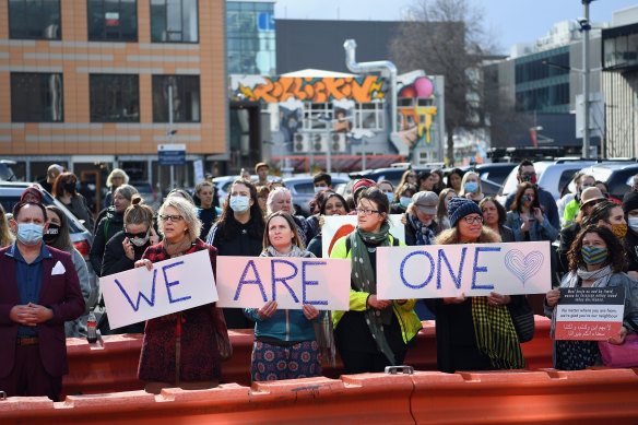 New Zealanders outside the Christchurch High Court show their support to the families of the dead and to survivors during the sentencing of Brenton Tarrant.