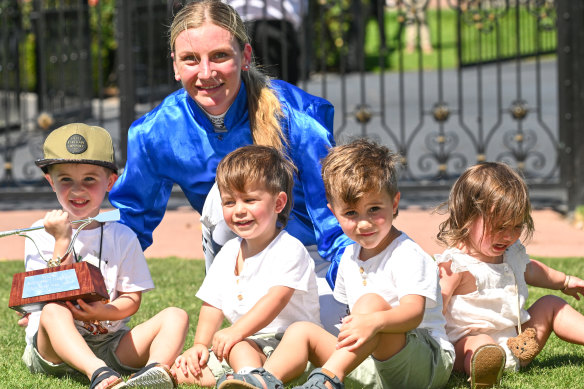 Jamie Kah poses with the Dean Holland Trophy and his four children after winning the 2024 Newmarket Handicap.