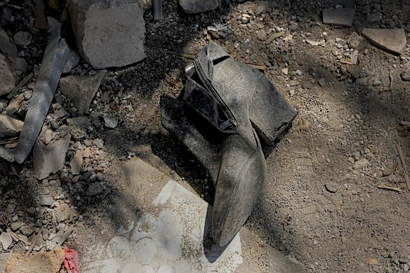 A woman's shoe lies in the house of the Khatib family in the a tamra's Israel city on June 15. Home has been picked up by an iranian ballistic missile that killed four women.