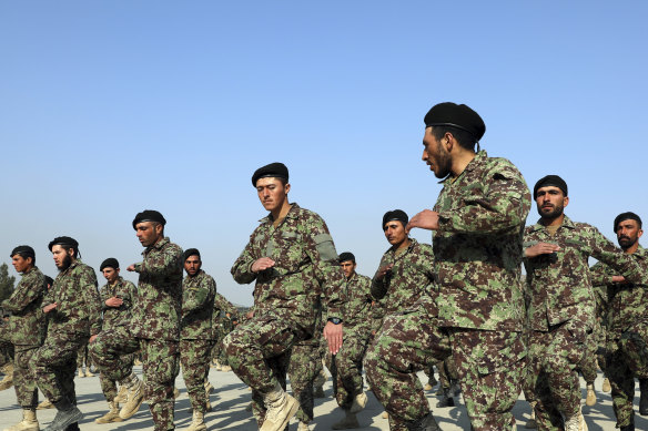 Newly graduated Afghan National Army soldiers march at their graduation ceremony.