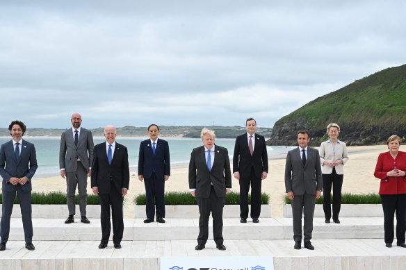 G7 leaders pose for the obligatory “family photo” in Carbis Bay.