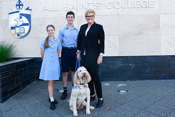 All Saints’ College principal Belinda Provis, with college captains Chloe Glass and Kanin Hoar, and dog Max.