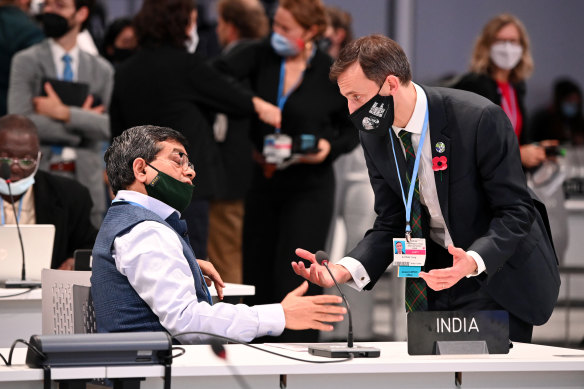 A member of the Indian delegation in an exchange with United Kingdom negotiator Archibald Young. 