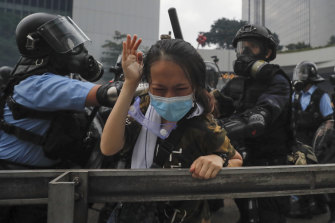 Riot police tackle a protester outside the Legislative Council in Hong Kong.