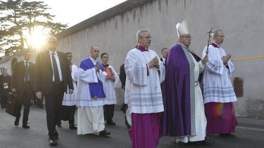 Pope Francis leaves the Basilica of Saint Anselmo walking in procession to the Basilica of Santa Sabina before the Ash Wednesday mass.