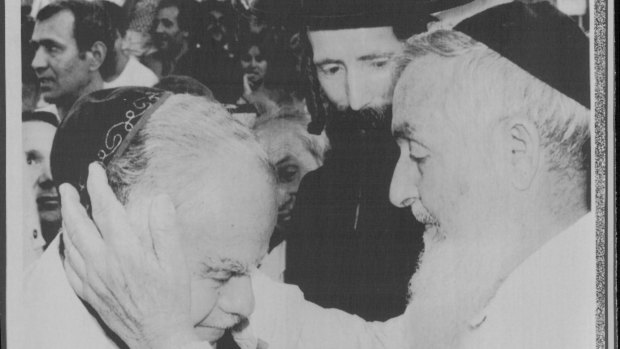 Israel's then Prime Minister Yitzhak Shamir (left) is blessed by Rabbi Menachem Abraham in 1984 while Rabbi Yitzhchak Dovid Grossman (also known as the Disco rabbi) looks on. 