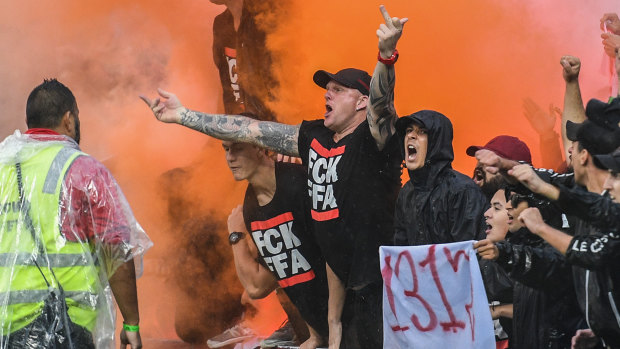 Tensions flare: The Red and Black Bloc react after an Oriol Riera goal for Wanderers against Sydney FC last weekend.