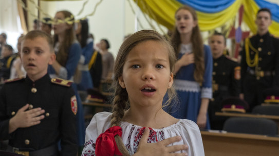 Students of a military school sing the national anthem in Kyiv on Ukraine’s Statehood Day. Cadets launched a crowdfunding campaign to buy the first F-16 Fighting Falcon jet to help the Ukrainian air forces fighting against Russia.