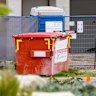 Stock image of skip bin in front of house in Australian suburb. Picture: Adobe Stock