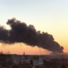 A cloud of smoke rises after an explosion in Ukraine.