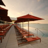 The rooftop pool and bar look across to the Coral Sea and Magnetic Island. 