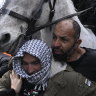 As it happened: Dozens arrested as demonstrators disrupt Melbourne weapons expo