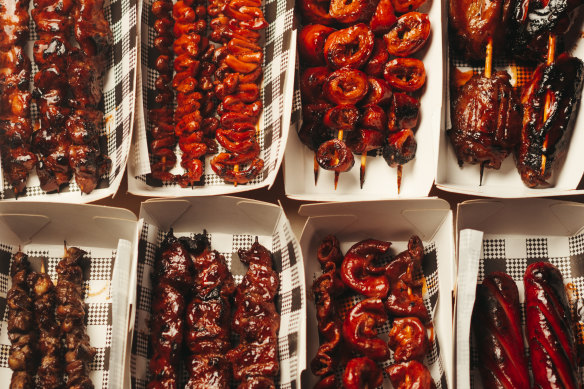 An assortment of skewers including pork small intestine, Filipino hotdog and chicken wings.