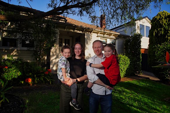Martin Clark with his partner Catherine Pitre and their children Olivia, 7, and Elliot, 4, at their rental home in Glen Iris.
