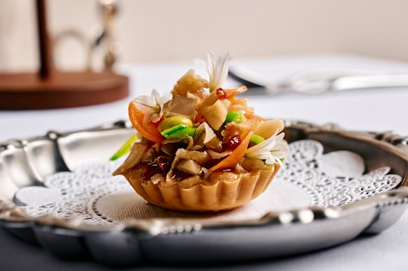 Rosheen Kaul’s tartlet of stir-fried water chestnut with cured ham and shaoxing wine jelly.