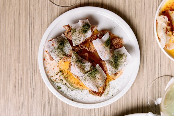 Fried chicken with chilli vinegar, pickled daikon and betel leaf.