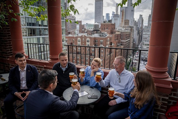 Denmark’s Prime Minister Mette Frederiksen, Greenland’s leader Jens-Frederik Nielsen, and Greenland’s Minister for Foreign Affairs Múte B. Egede have a beer after the deal with Donald Trump was signed.