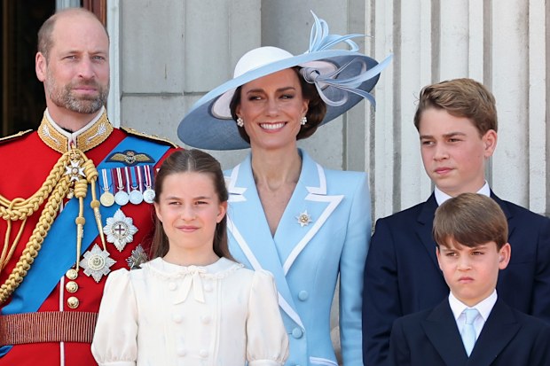  (L-R) Prince William, Prince of Wales, Princess Charlotte of Wales, Catherine, Princess of Wales, Prince George of Wales and Prince Louis of Wales watch an RAF flypast from the balcony of Buckingham Palace during Trooping The Colour