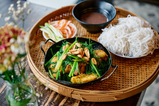 Hanoi speciality cha ca la vong (fish grilled with turmeric and dill) at Co Thu Quan.