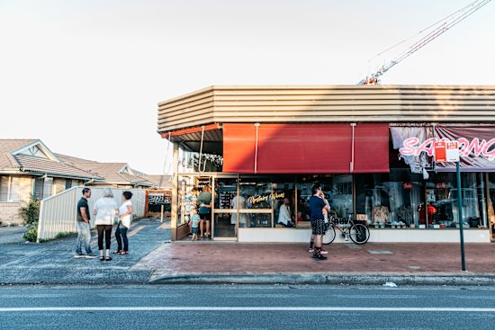 The wine shop is not actually upstairs but on the ground level.