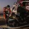 Price drops back, Alonso rolls car down a dune in Dakar Rally
