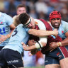 SYDNEY, AUSTRALIA - MAY 31:  Josh Nasser of the Reds is tackled during the round 15 Super Rugby Pacific match between NSW Waratahs and Queensland Reds at Allianz Stadium, on May 31, 2024, in Sydney, Australia. (Photo by Matt King/Getty Images)