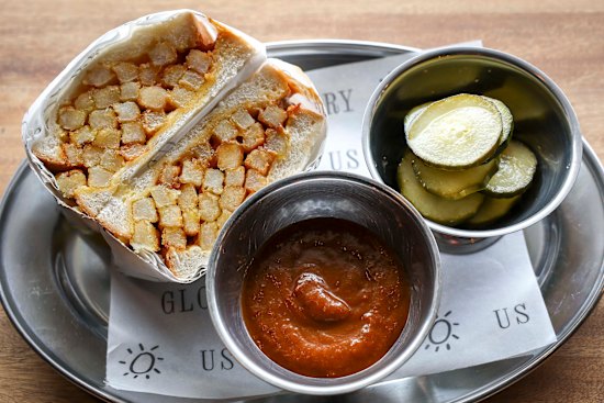 Somewhere between shoestring and thick-cut, the chips are painstakingly placed vertically on the buttered bread, creating four or so layers, and the perfect cross-section.