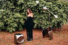 Kym Ellery in Ibiza with her Moulin floor lamp and Rocher side table.