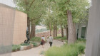The new building (right) follows the curve of the 2003 building; a new sculpture park meandering between.