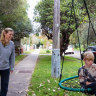 Good news for some: Rachael Robinson with her son Lewis on Dudley street, Balgowlah.