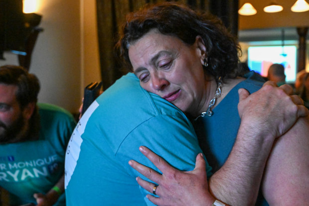 Ryan embracing her brother Peter on election night, remembering Peter’s son Hector, who died in 2017, hours after his VCE exams. Ryan was the first to their house at 3am that night and took Peter and his wife Cate to the Coroner’s Court to identify Hector’s body.