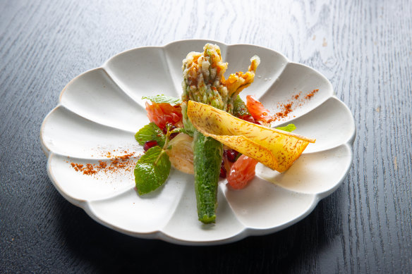 Crispy zucchini flowers ($12 each) are stuffed with ricotta, and served with pomegranate and pomelo, as well as a honey yoghurt.