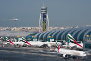 An Emirates jetliner comes in for landing at the Dubai International Airport in Dubai, United Arab Emirates, Dec. 11, 2019. Airlines across the world, including the long-haul carrier Emirates, rushed Wednesday, Jan. 19, 2022, to cancel or change flights heading into the U.S. over an ongoing dispute about the rollout of 5G mobile phone technology near American airports. (AP Photo/Jon Gambrell, File)