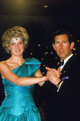 Charles and Diana, wearing Queen Mary's necklace as a headpiece, at a ball in Melbourne in October 1985.