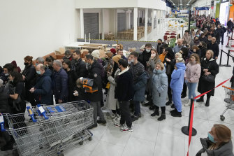 People wait to enter the IKEA store on the outskirts of St Petersburg, Russia, on March 3, 2022 after IKEA announced it would close its stores in Russia and Belarus.