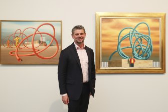 NGA director Nick Mitzevich with two works in the Jeffrey Smart exhibition on December 10.