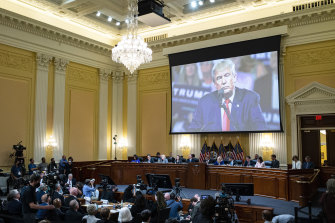 An image of former President Donald Trump is displayed as the House select committee investigating the January 6 attack on the US Capitol continues to reveal its findings of a year-long investigation.