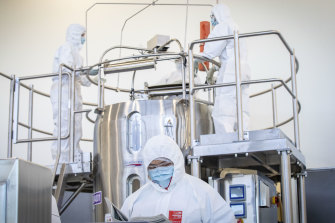 Staff at a CSL lab, where the AstraZeneca lab is being produced.