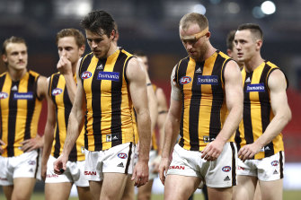 Dejected Hawks players after their loss to Collingwood on Friday night.