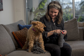 Emily McNamara, 33, is enjoying her new knitting hobby,  as is 11-week-old groodle Murray.