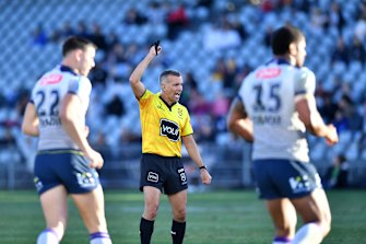Referee Matt Cecchin signals six-again during a Storm-Warriors clash earlier this season.