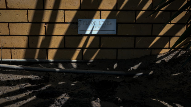 The plaque showing the 2011 flood level on the side of the Kilpatrick’s house.