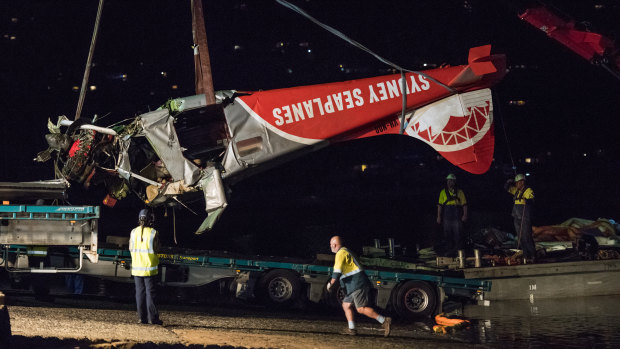 The wreck of the crashed seaplane is pulled from the water in January 2018. 